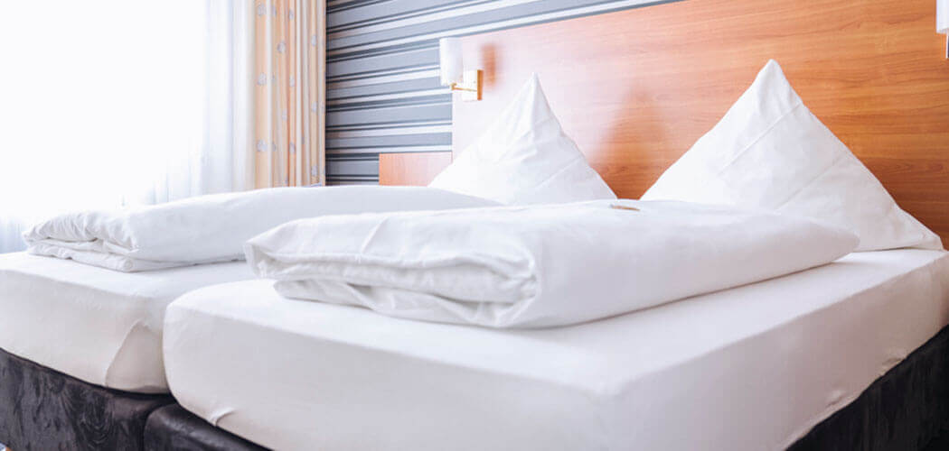 Double bed in a spacious suite in the Hotel Alexa Bad Mergentheim